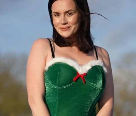 Charlie Rose wearing green tube top