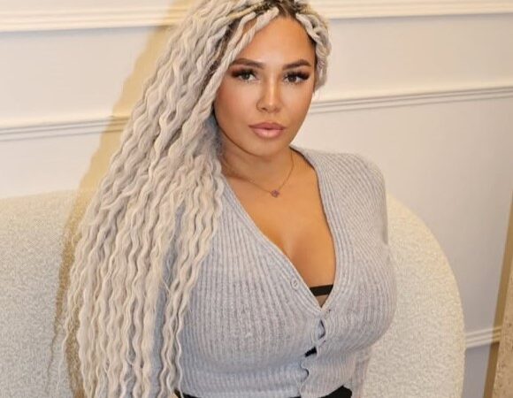 Lexi G wearing a tight cardigan