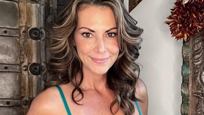 Kitty wearing green lingerie