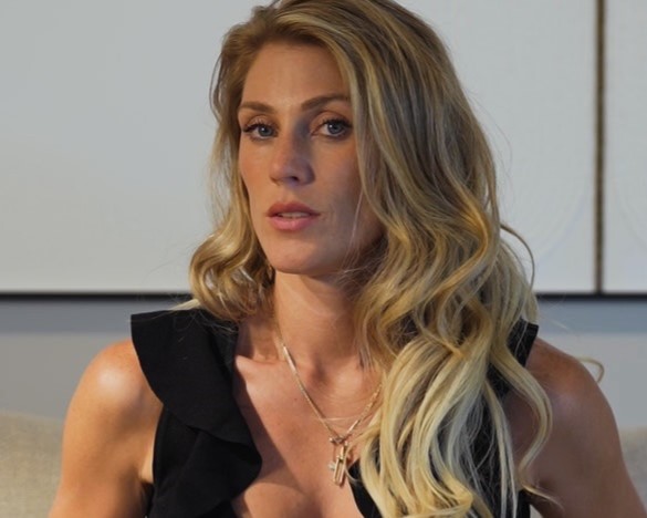 Sachas Office wearing a black dress