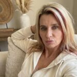 Amanda Dalton wearing lounge wear at her living room couch