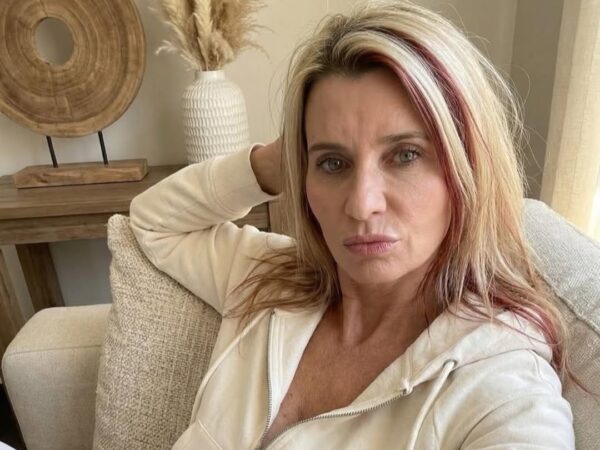 Amanda Dalton wearing lounge wear at her living room couch